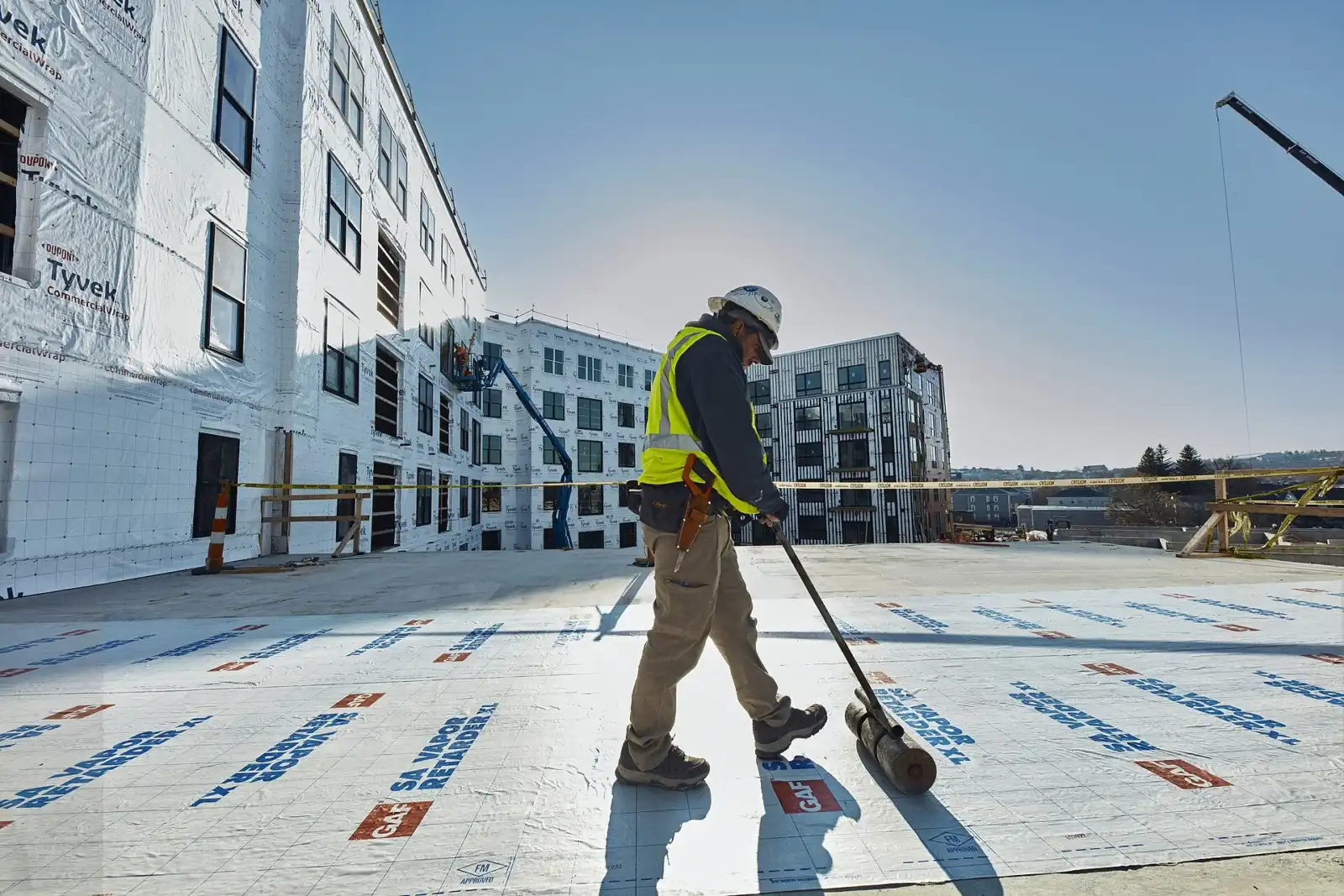 Roofing crew installing a commercial roof system in Los Angeles