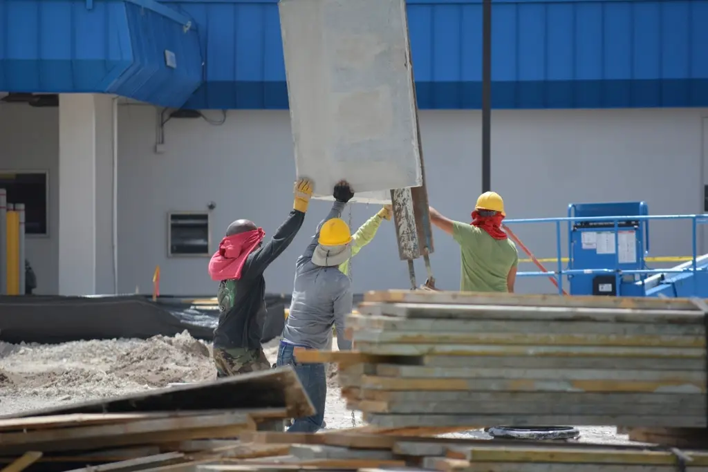 Roofing crew working together on a roof