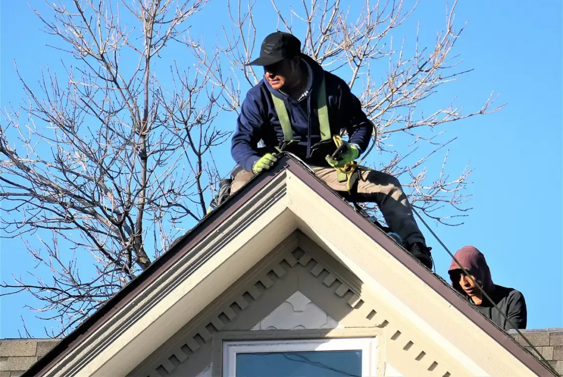 Roofers working on a roof installation